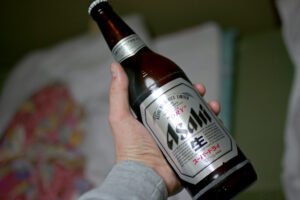 A bottle of asahi beer at hand